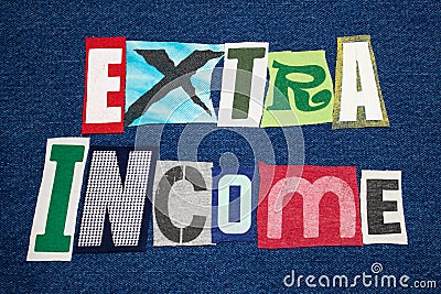 EXTRA INCOME text word colorful fabric collage on blue denim, side hustle Stock Photo