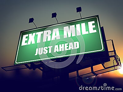 Extra Mile Just Ahead on Green Billboard. Stock Photo