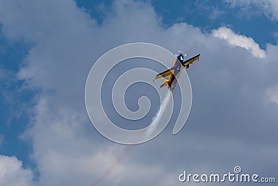 Extra 330SC aicraft part of Hawks of Romania team flying and doing aerial acrobatics Editorial Stock Photo