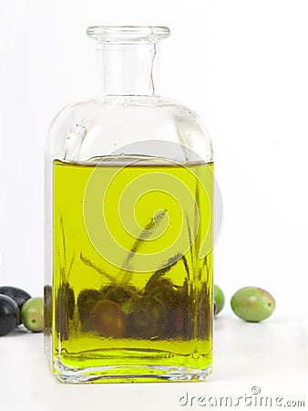 Extra virgin olive oil with fresh olives. Stock Photo