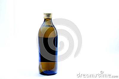 Extra virgin olive oil on plain white background. Stock Photo