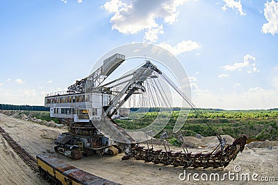 Extraction of sand in the quarry of a huge excavator Stock Photo