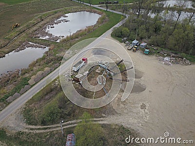 Extraction, washing, sorting and distraction of river gravel. Mining industry. Technology of obtaining a stone. A bird`s eye view. Stock Photo