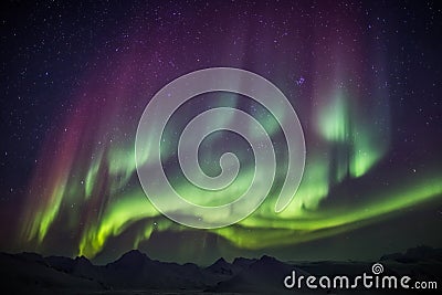 Extraordinary Aurora Borealis on the Arctic sky - Spitsbergen, Svalbard Stock Photo