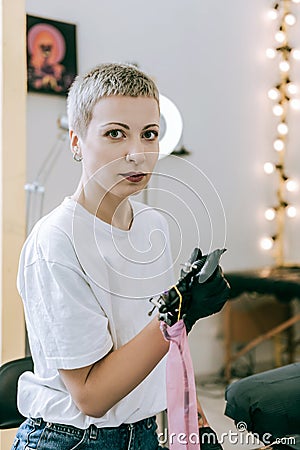 Extraordinary boyish female master being prepared for work Stock Photo