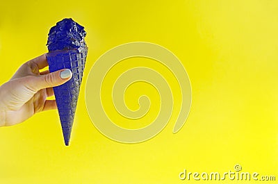 Extraordinary colored ice cream against sunny yellow background Stock Photo