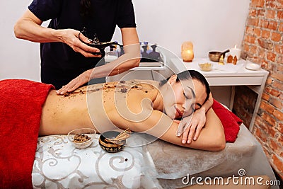 Extraordinary master in beauty salon using exotic tools and unusual materials Stock Photo