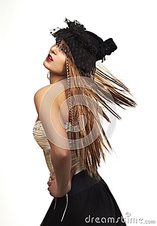 Extravagant woman with long hair Stock Photo