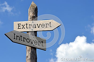 Extravert or introvert - wooden signpost with two arrows Stock Photo