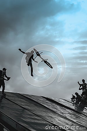Extrem Sport and risk. Unsuccessful performance at competitions. Fall from BMX bike. Risky moment of falling falls into Stock Photo