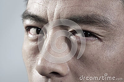 Extreme Close up on angry mans face Stock Photo