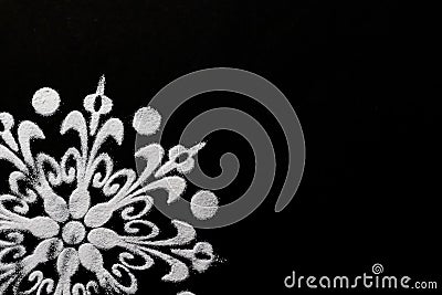 Extreme close up of cropped white rangoli design on black background. diwali concept Stock Photo