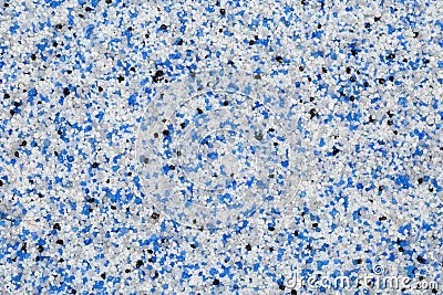 Extreme close up of decorative quartz sand epoxy floor or wall coating with blue, grey, white and black coloured particles Stock Photo