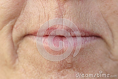 Extreme Closeup on the mouth of a middle-aged woman Stock Photo