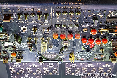 Old aircraft cockpit control panels with switches and gauges. Stock Photo