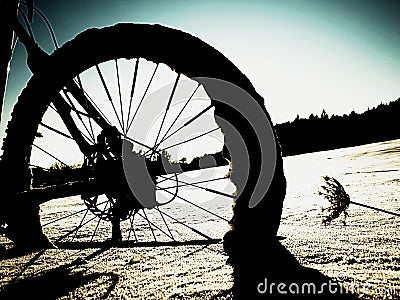 Extreme contrast. Mountain bike stay in powder snow. Lost path in deep snowdrift. Stock Photo