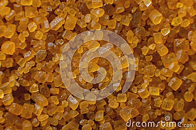 Extreme macro. Sugar crystals. Close-up of brown cane sugar on a plane. Texture or background of wholesome brown sugar Stock Photo