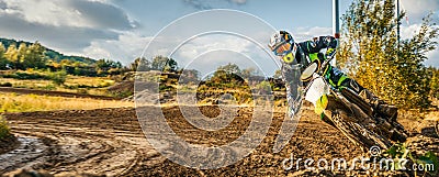 Extreme Motocross MX Rider riding on dirt track Stock Photo