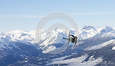 Extreme Skier jumps up high Editorial Stock Photo