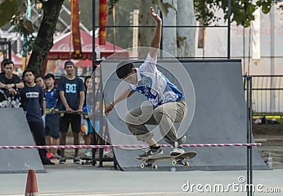 Extreme sports activity outdoor. Young skater boy rides on a skateboard Editorial Stock Photo