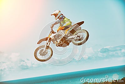 Extreme sports, motorcycle jumping. Motorcyclist makes an extreme jump against the sky. Extreme sports, motorcycle Stock Photo