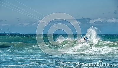 Extreme sports photography of athlete on kiteboard surfing Stock Photo