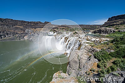 Extreme wide angle view of Shoshone Falls waterfall with rainbow in Twin Falls Idaho Stock Photo