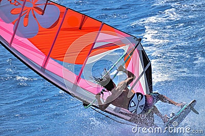 Extreme windsurfing, the moment of the surfer`s falling of the speeding from the board, during a strong gust of wind, Dahab, Egyp Editorial Stock Photo