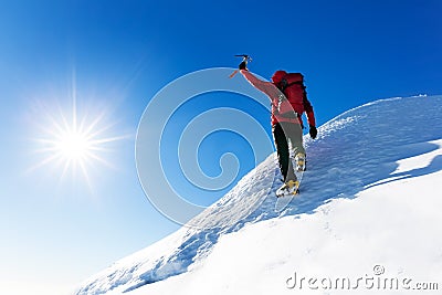 Extreme winter sports: climber at the top of a snowy peak in the Stock Photo