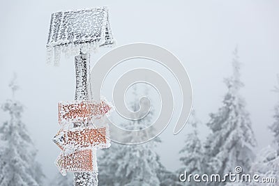 Extreme winter weather - hiking path sign covered with snow Stock Photo