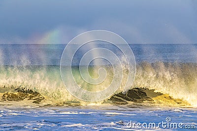 Extremely high huge waves with rainbow in Puerto Escondido Mexico Stock Photo