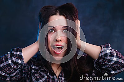 Extremely surprised, excited, shocked young woman touching her h Stock Photo