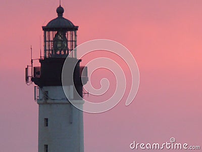 Extremity of a lighthouse in a pink sky to Biarritz in France Stock Photo