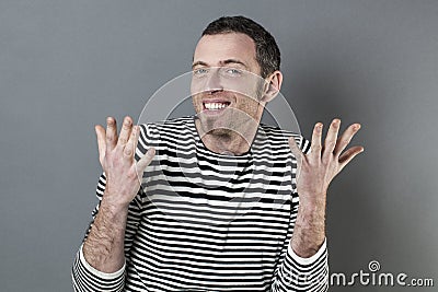 Extrovert 40s man expressing himself with hands Stock Photo