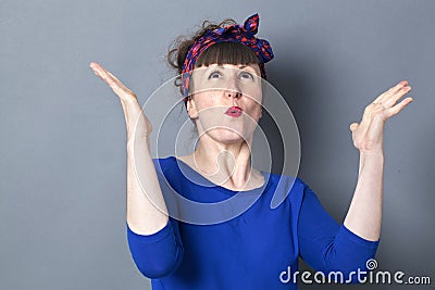 Extrovert 30s woman with fifties hairstyle enjoying competition Stock Photo