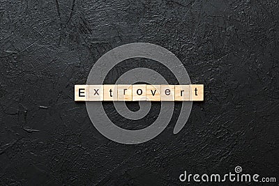 extrovert word written on wood block. extrovert text on table, concept Stock Photo