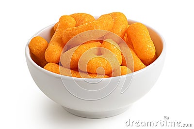 Extruded cheese puffs in a white ceramic bowl isolated on white Stock Photo