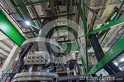 Extruder produces recycled black plastic trash bags Stock Photo