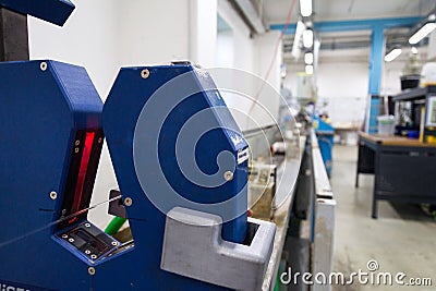 Extrusion on production line of 3D printing filament Stock Photo