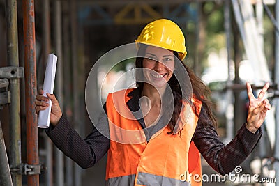 Giving the V-sign on construction site Stock Photo