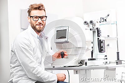 Eye doctor with ophthalmologic device Stock Photo