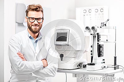 Eye doctor with ophthalmologic device Stock Photo