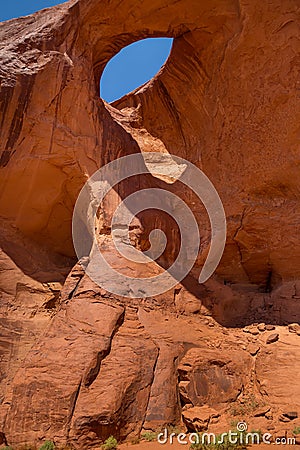 Eye of the eagle Big Hogan. Pothole natural arch eroded in sandstone. Stock Photo