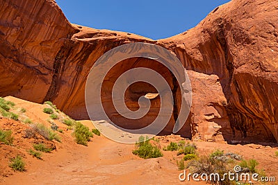 Eye of the eagle Big Hogan. Pothole natural arch eroded in sandstone. Stock Photo