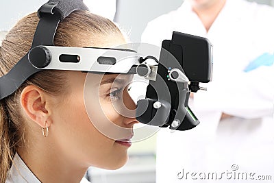 An eye exam at an ophthalmologist, ophthalmoscope Stock Photo