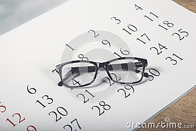 Eye Glasses on Calendar in white Tone Stock Photo