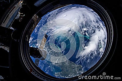 Eye of the hurricane. Typhoon over the planet Earth, view through the porthole of the space station. A category 5 super Typhoon Stock Photo