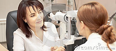 Eye ophthalmologist exam. Eyesight recovery. Astigmatism check concept. Ophthalmology diagmostic device. Beauty girl portrait in Stock Photo