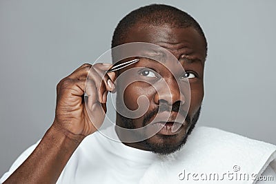 Eyebrow Plucking. Facial Beauty Routine. Hair Correction And Grooming. Stock Photo