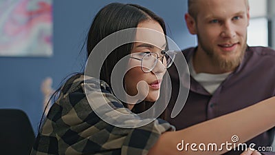 Eyeglasses girl gesturing at video call remote workplace. Students brainstorming Stock Photo